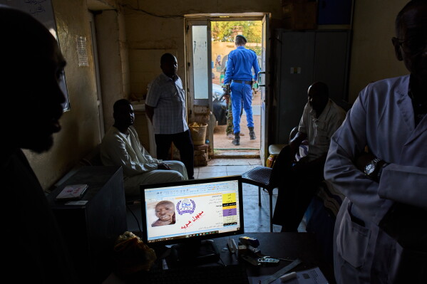 A computer screen displays a record of an unidentified body in the missing persons database at Al Nao Hospital in Omdurman, Sudan, Saturday, April 18, 2026. (AP Photo/Bernat Armangue)