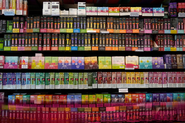 Disposable flavored electronic cigarette devices are displayed for sale at a store in Pinecrest, Fla., June 26, 2023. (AP Photo/Rebecca Blackwell, File)