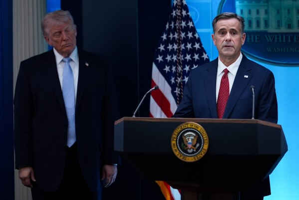 CIA Director John Ratcliffe, accompanied by President Donald Trump, speaks with reporters in the James Brady Press Briefing Room at the White House in Washington, April 6, 2026, File)