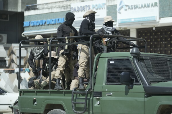 FILE -Police patrol the streets on election day in Zanzibar, Tanzania, Oct. 30, 2025. (AP Photo, File)